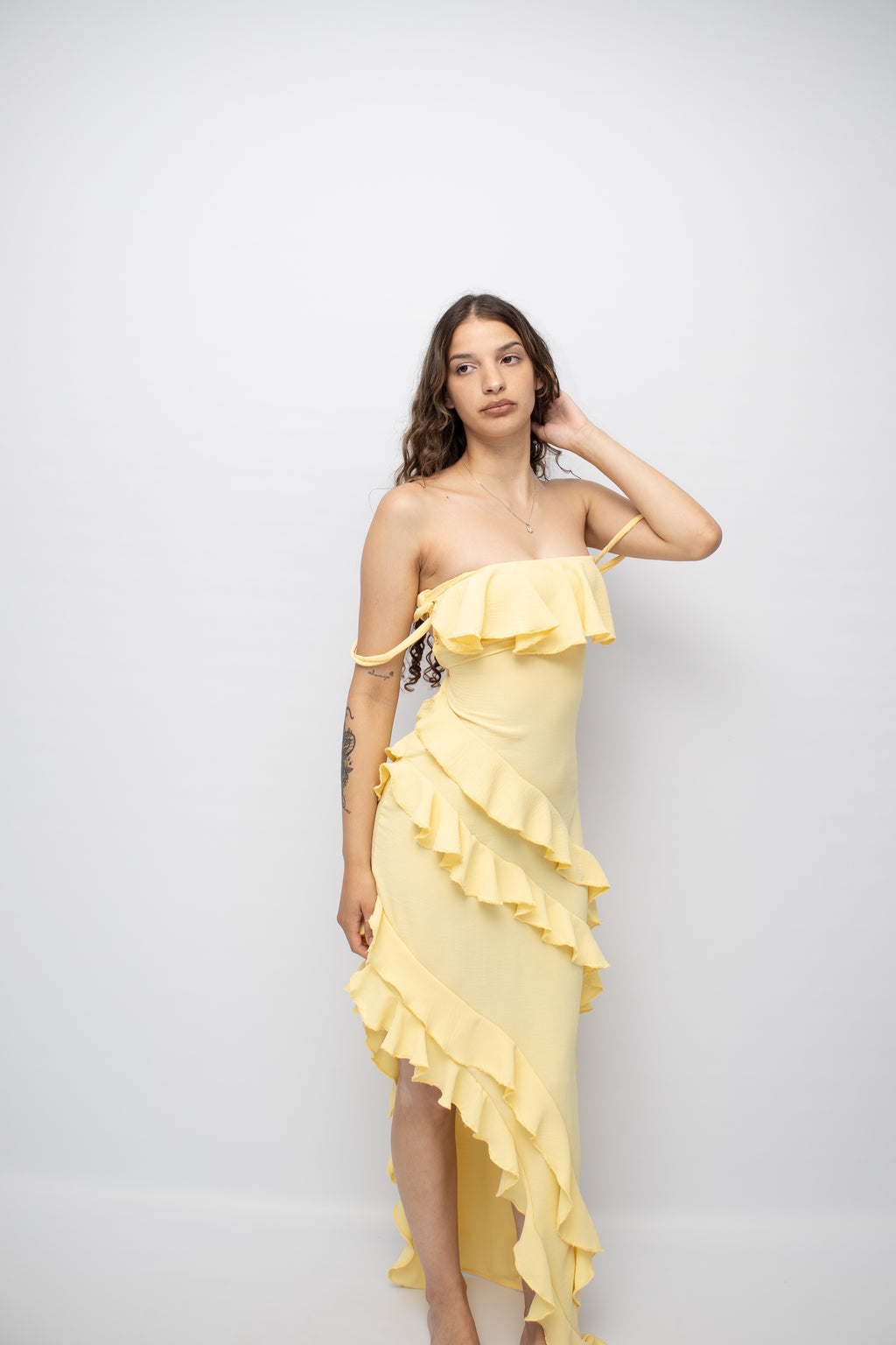 Butter yellow ruffle dress .