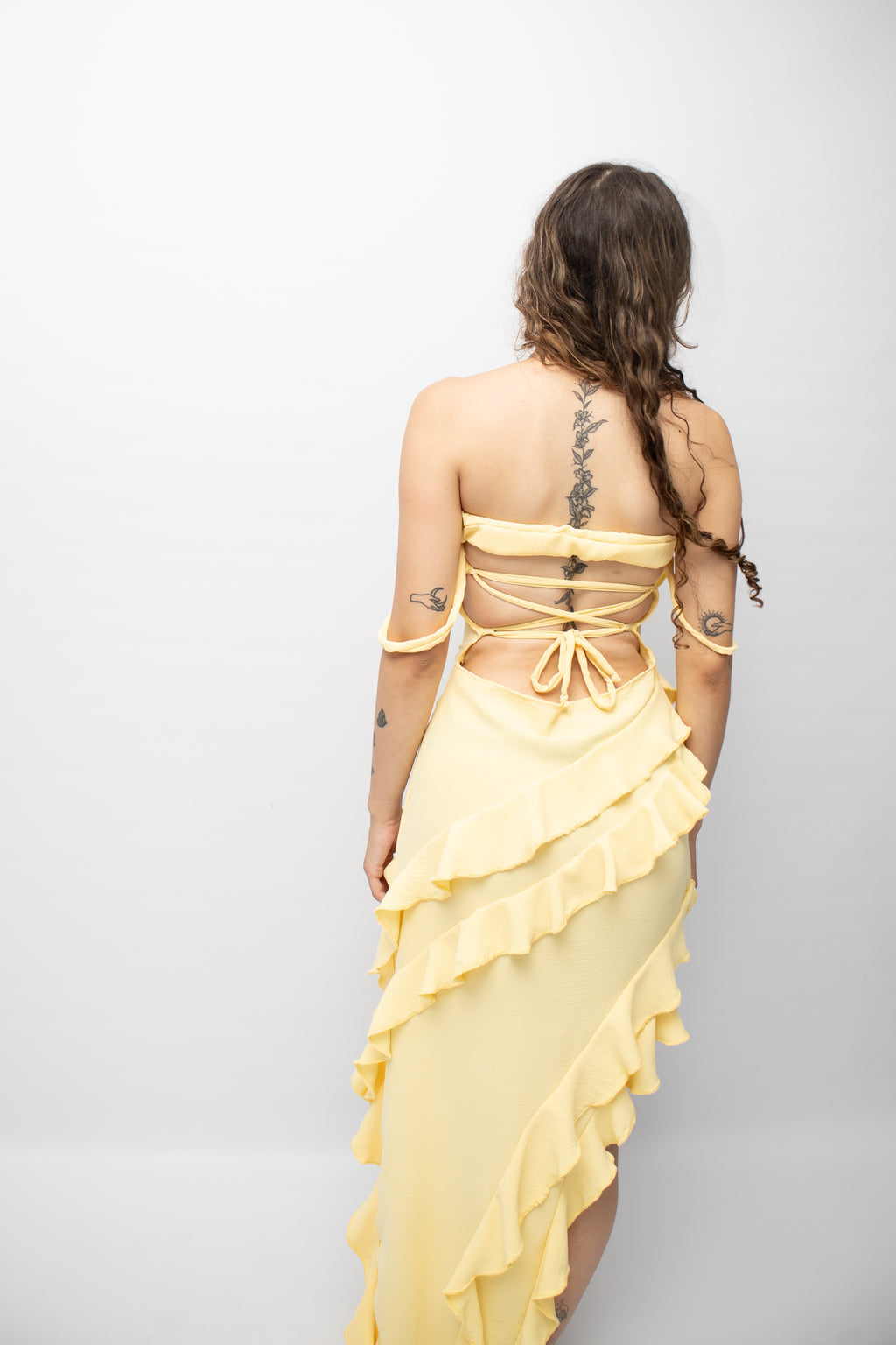 Butter yellow ruffle dress .